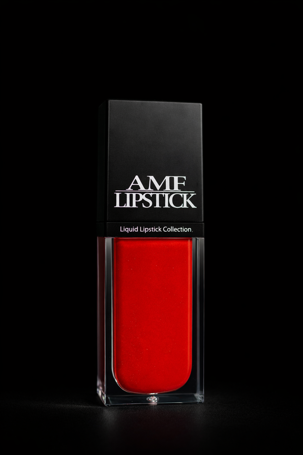 Red lipstick in a clear case with 'AMF Lipstick' packaging on a black background